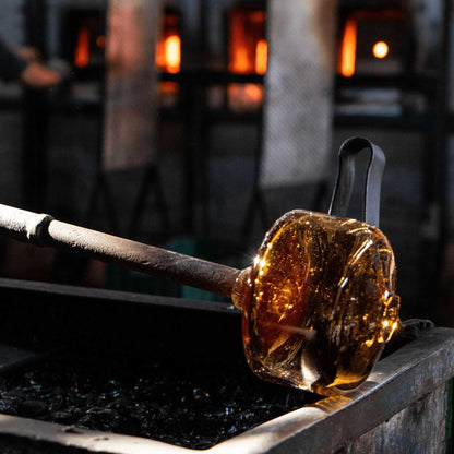 bluecorn's blown glass candle holder in the glass blowing process. these candle holders are artisan-made from 100% post-consumer content