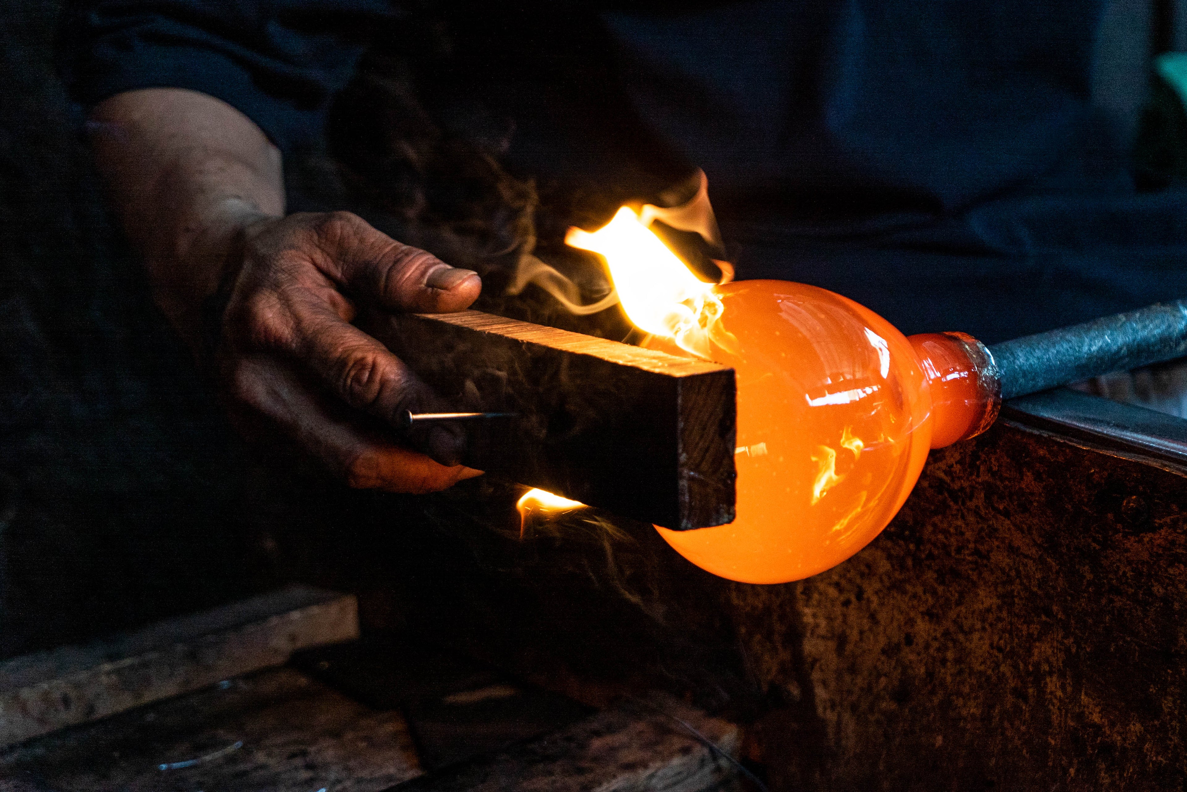 Load video: A gorgeous video depiction the artisan glass blowing process used to make Bluecorn&#39;s 100% recycled glass candle holders